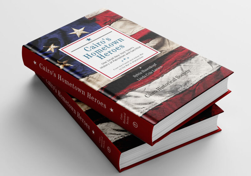 stack of two hardcover books with flag