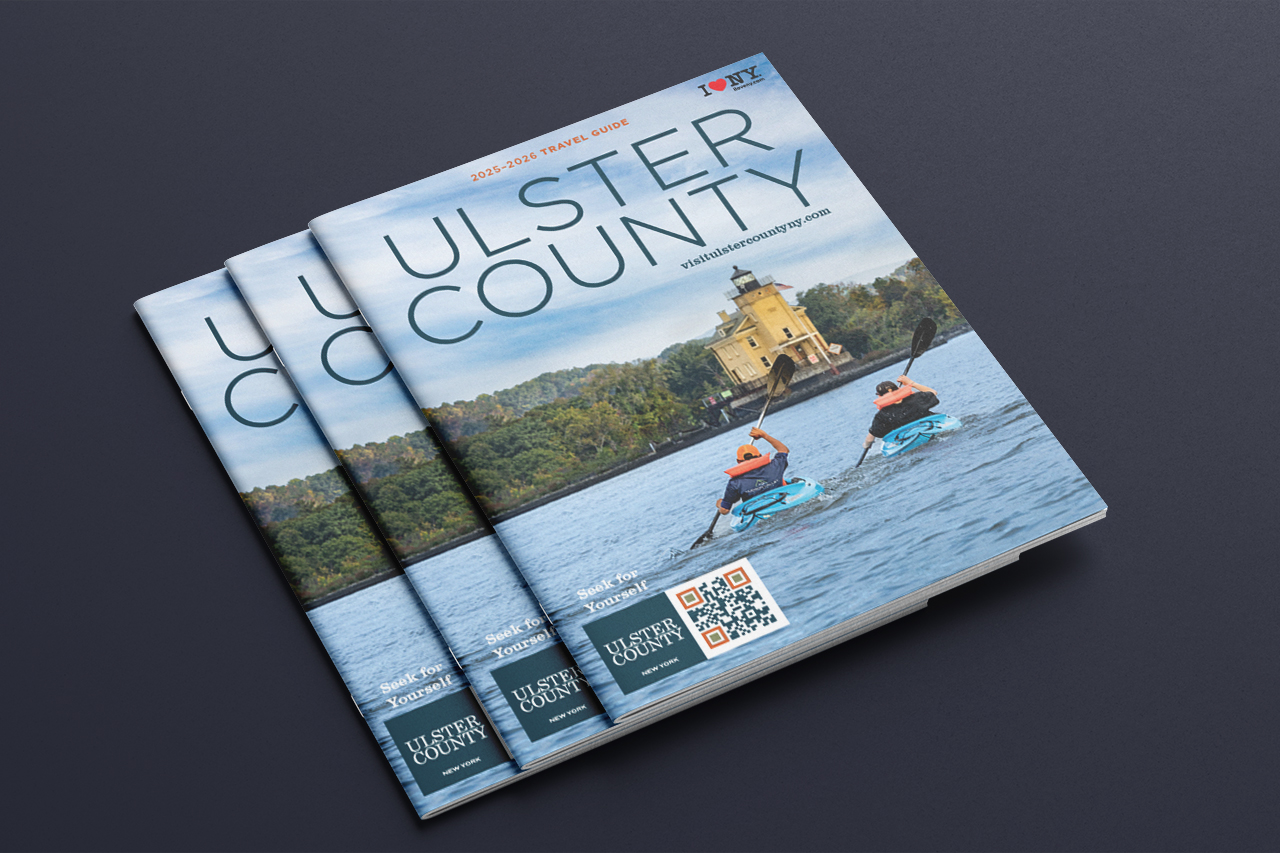 three travel gu9ide covers fanned out on a gray background