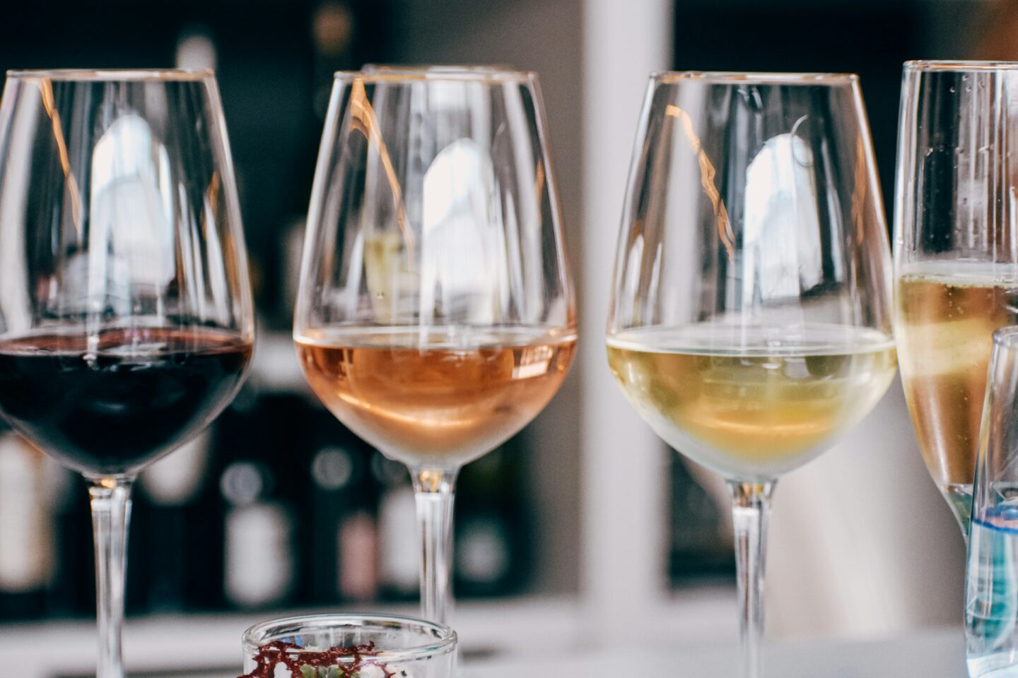 four wine glasses in a row